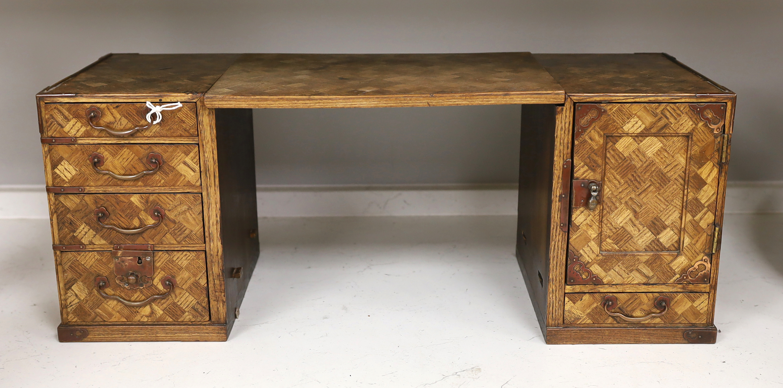 An early 20th century Japanese parquetry table cabinet or scholar's box, 24.5cm high, 63cm wide when extended